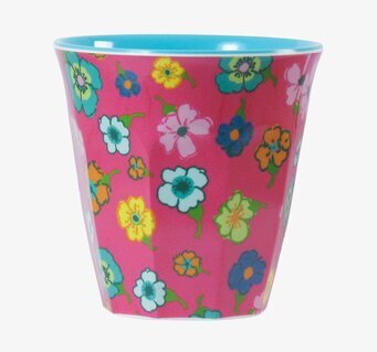 Bild av färgglad mugg med blommönster och blå insida