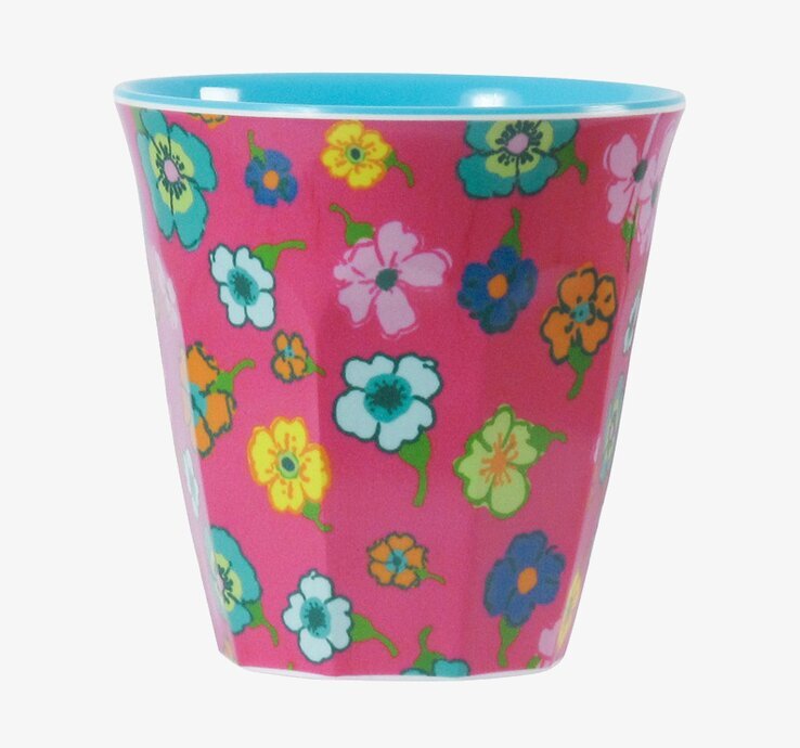 Bild av färgglad mugg med blommönster och blå insida