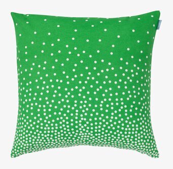 Bild av kuddfodral med grön färg och vita prickar