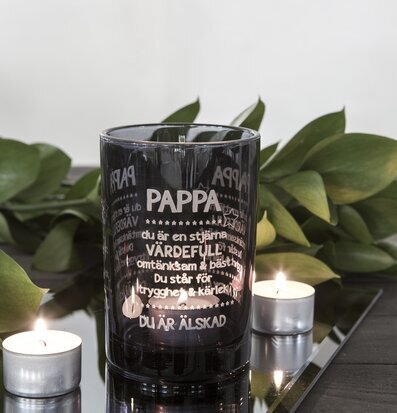 Bild av elegant ljuslykta i blått glas med värmeljus