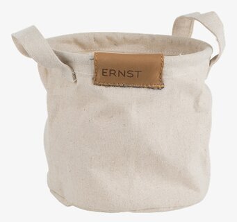 Bild av rund beige tygkorg med handtag för hemmet