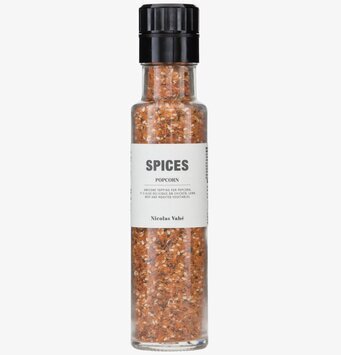 Foto av stilren kryddbehållare med färgglada kryddor