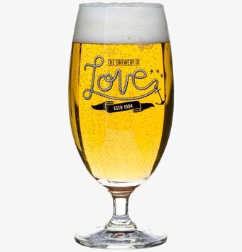 Foto av elegant ölglas med stilren design och text