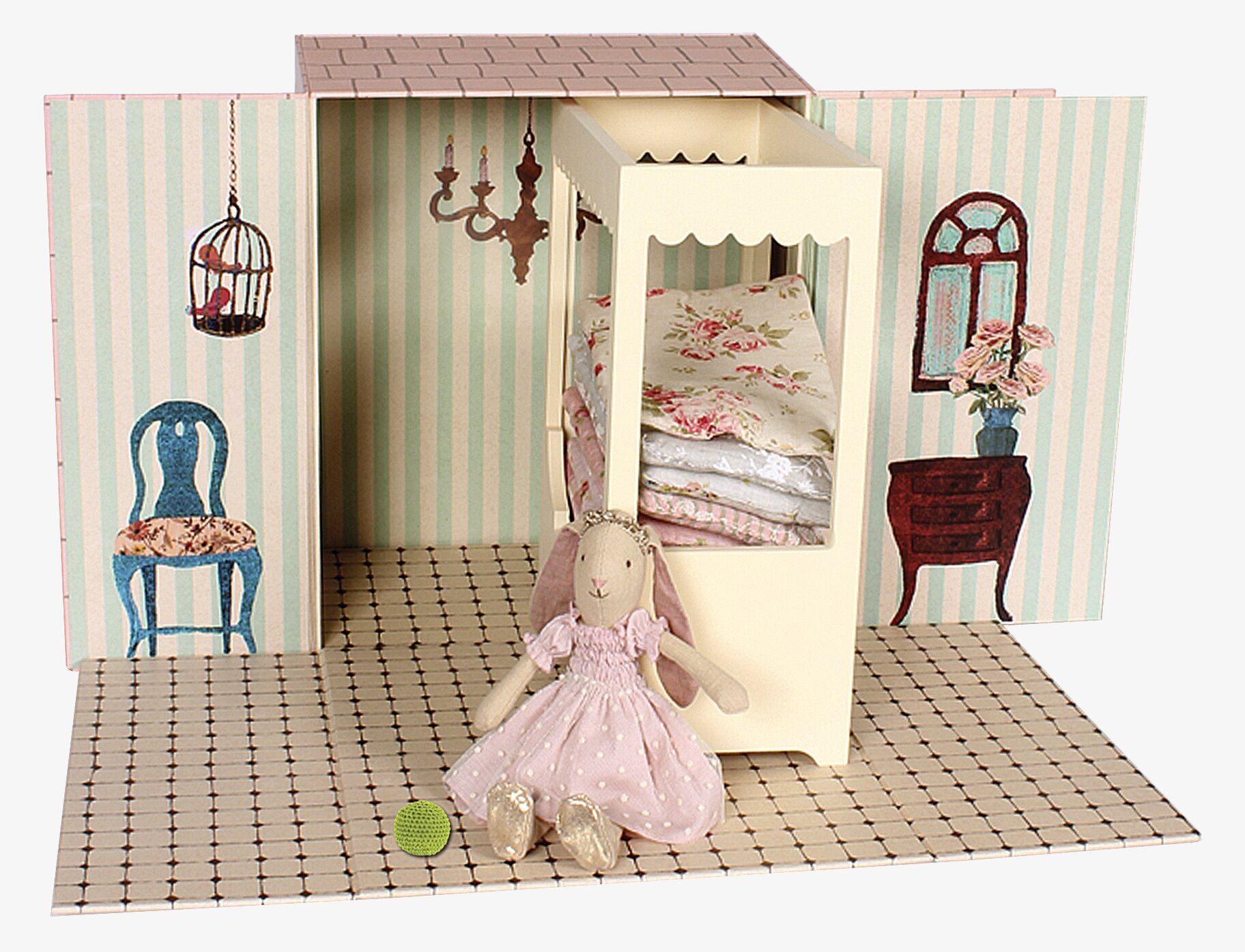 Bild av charmig miniatyrscen med kanin och säng