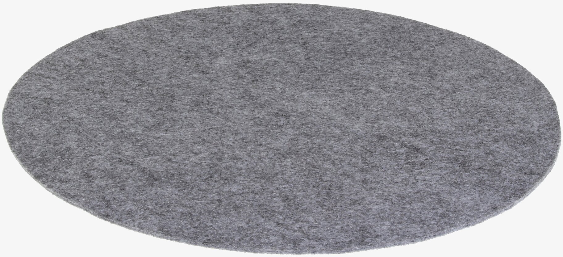 Foto av stort runt underlägg i dämpad grå färg