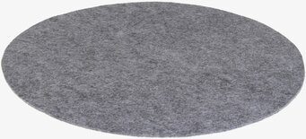 Foto av stort runt underlägg i dämpad grå färg