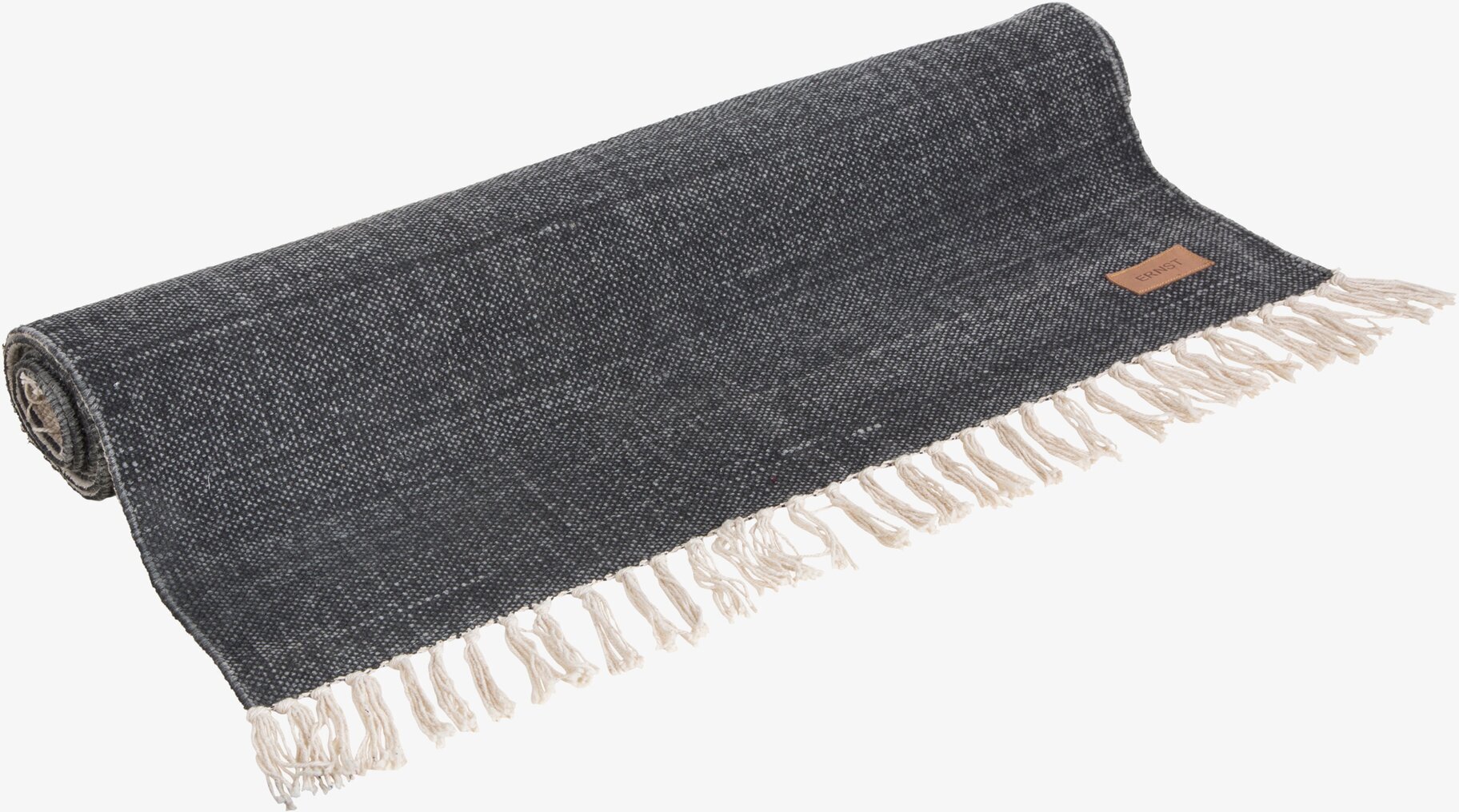 Foto av grå rektangulär matta med fransar och mönster