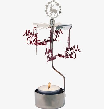 Foto av ett änglaspel med julmotiv och varm atmosfär