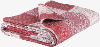 Bild av vackert quiltad röd och vit patchwork-pläd