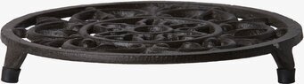 Bild av ett rustikt grytunderlägg i järn med mönster