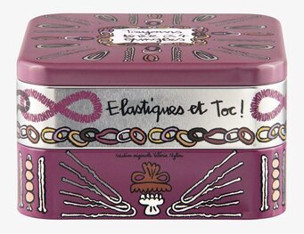 Bild av lila plåtburk för håraccessoarförvaring