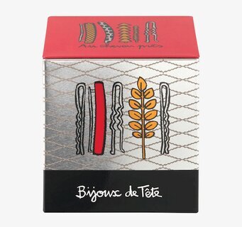 Bild av stilfull plåtburk för håraccessoarer hemma