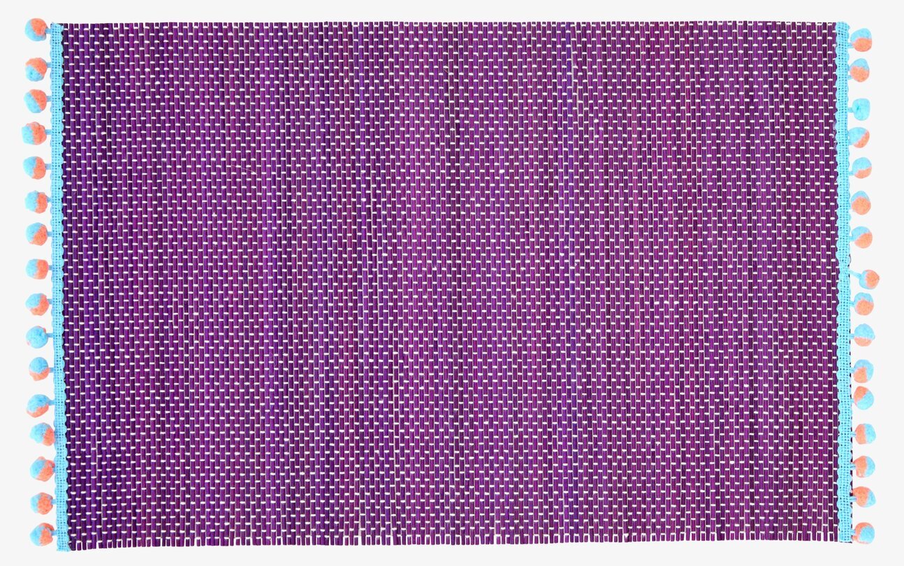 Bordsunderlägg Pom Pom från Rice med färgglada pom poms