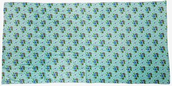 Bild av badhandduk med korsstygnsdesign i mintgrönt