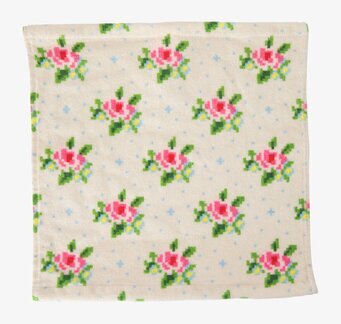 Bild av tvättlapp med blommönster och korsstygn