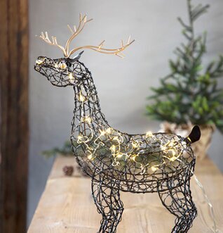 Bild av stiliserad ren i svart smide med LED-ljus