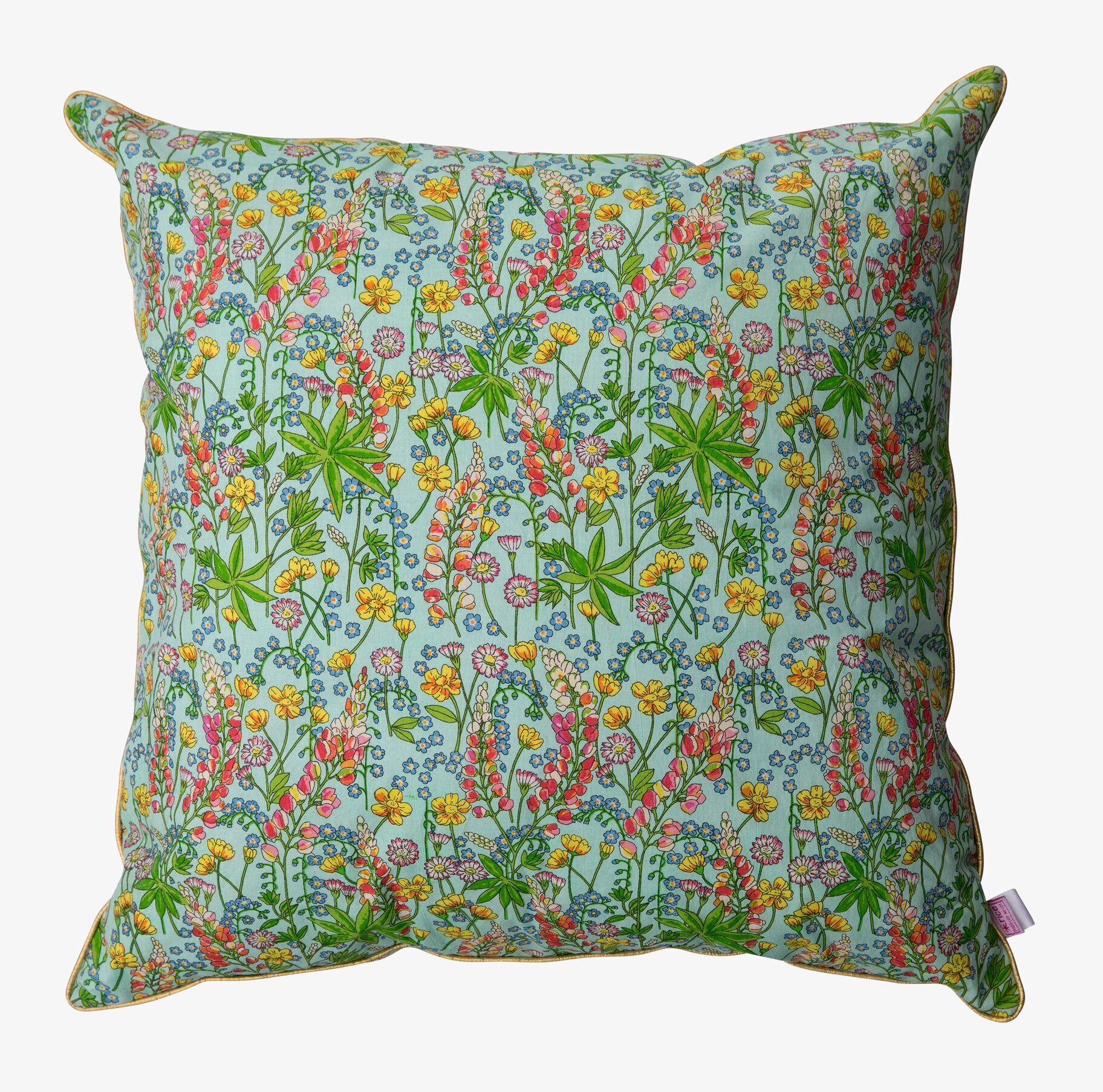 Bild av dekorativ kudde med blommönster och färg