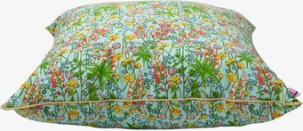 Foto av dekorativ kudde med blomstermotiv och passpoal