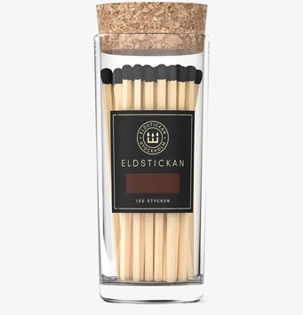 Bild av elegant glasburk med tändstickor och korklock