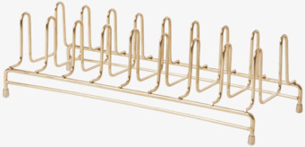 Bild av stilrent tallriksställ i gyllene metallfinish