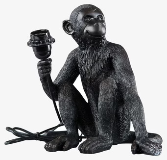 Bild av unik svart apa-lampa som bordsdekoration