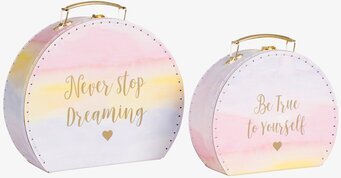 Bild av konstnärliga runda väskor med inspirerande text