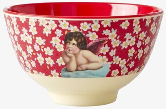 Foto av en dekorativ skål med blommor och ängelmotiv