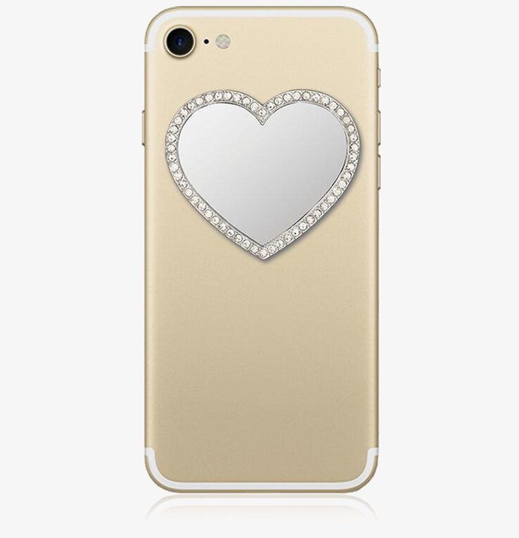 Bild av smartphone med hjärtformad spegel och kristaller