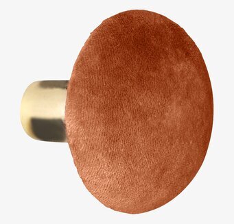 Bild av elegant rund sammetknopp i varm terrakotta