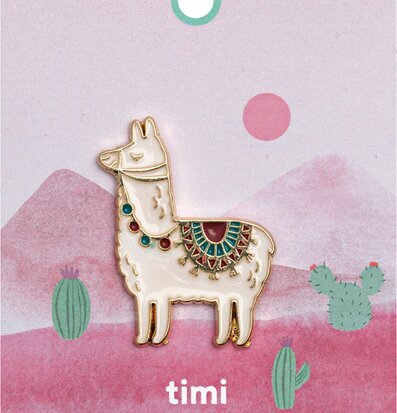 Bild av dekorativ pin med alpacka och färgglada detaljer