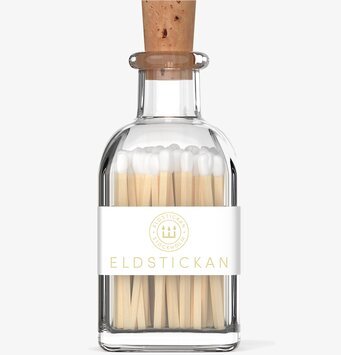 Bild av elegant glasburk med tändstickor i stilren design