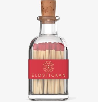 Bild av stilrena tändstickor i glasbehållare