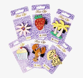 Bild av färgglada och unika hårspännen i solfjäderform