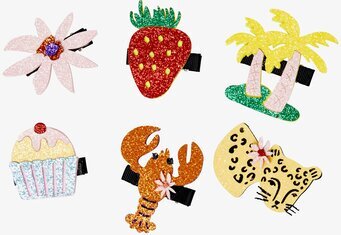 Bild av glittrande hårspännen med unika och färgglada motiv