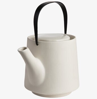 Foto av elegant vit tekanna i minimalistisk design