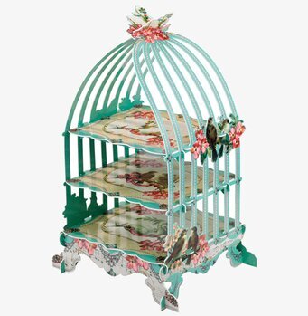 Foto av ett unikt kakfat i form av en fågelbur