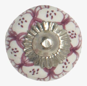 Bild av lila keramikknopp med blommönster och silverdetalj