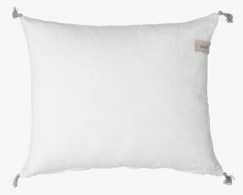 Bild av stilrent vitt kuddfodral i linne med tofsar