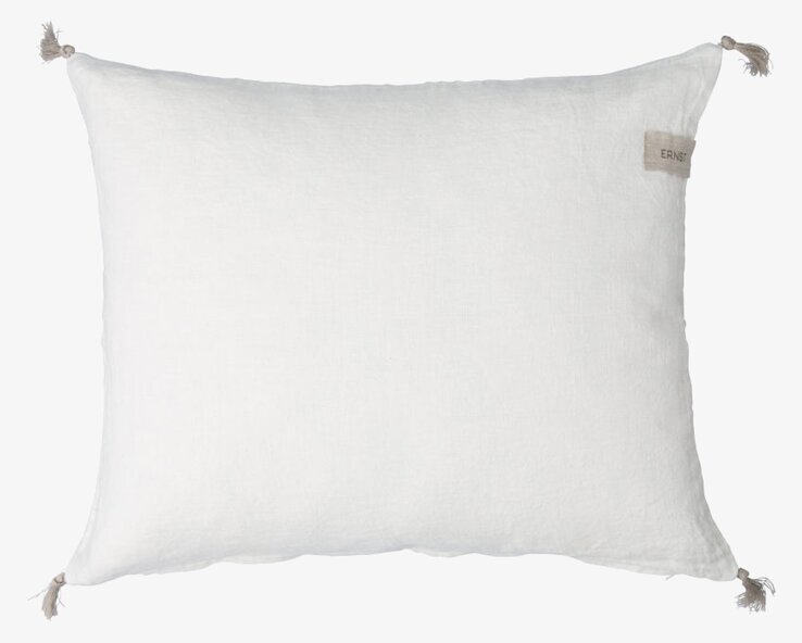 Bild av stilrent vitt kuddfodral i linne med tofsar
