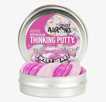 Bild av värmekänslig lera i metallburk med etikett