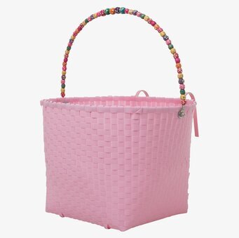 Bild av rosa cykelkorg med pärlhandtag och detaljer