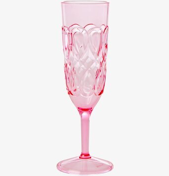 Bild av elegant rosa champagneglas med virvlande mönster