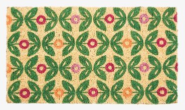 Bild av färgglad dörrmatta med blommönster och löv