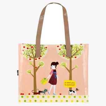 Bild av charmig handväska med lekfull design och naturmotiv