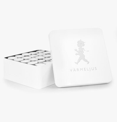 Bild av elegant plåtburk med värmeljus inuti