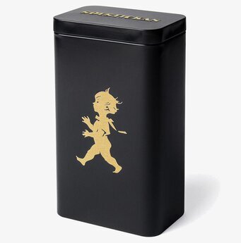 Bild av stilren svart och guld kaffeburk i metall