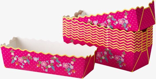 Bild av livfulla bakformar med blom- och prickmönster