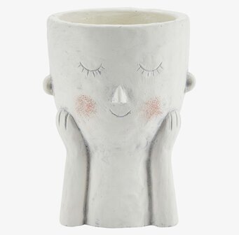 Foto av unik vit blomkruka med ansikte och händer