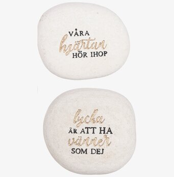 Bild av två dekorativa stenar med inspirerande citat