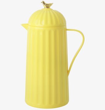Bild av gul termos med fågeldekoration och räfflor